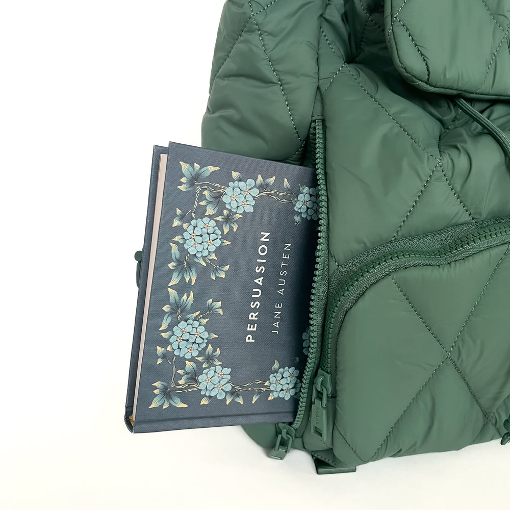 The Bookish Backpack in green on a blank backgorund